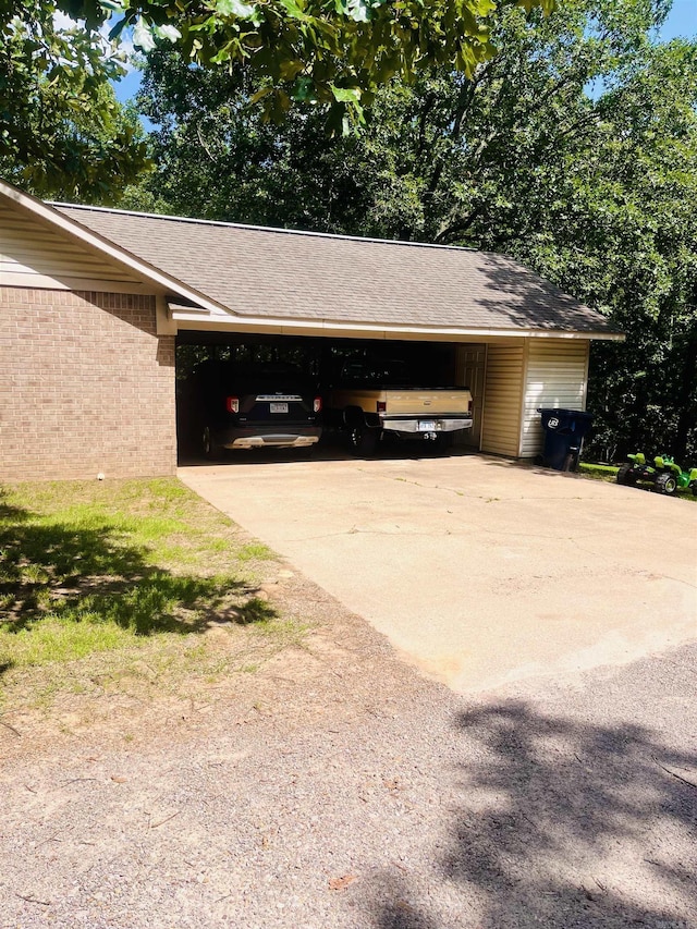 88 Cobblestone Rd, Plumerville, AR 72127 - view of vehicle parking featuring driveway and a carport