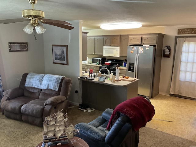living area with light colored carpet, ceiling fan, and baseboards