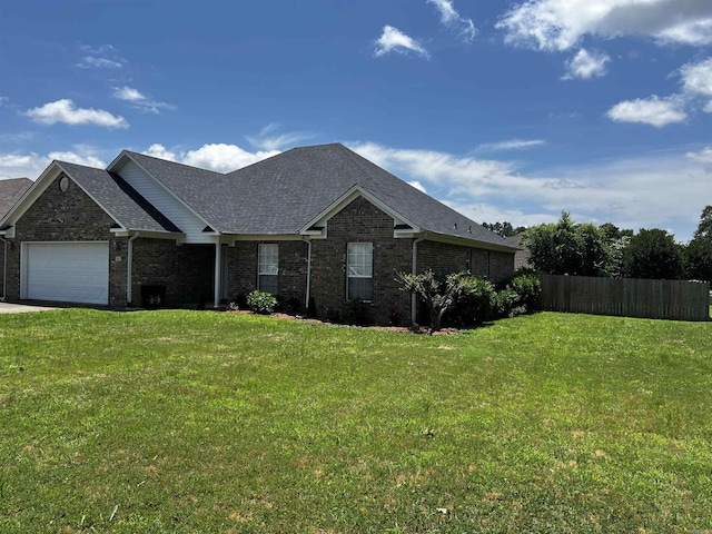 11 Willow Cv, Cabot, AR 72023 - view of front facade with brick siding, an attached garage, a shingled roof, and driveway