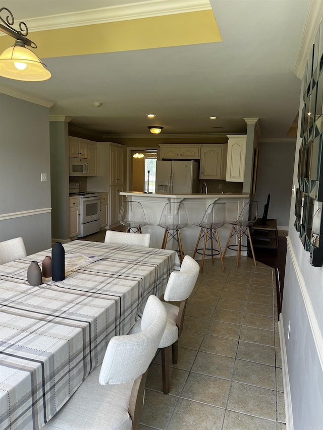 11 Willow Cv, Cabot, AR 72023 - dining area with crown molding, recessed lighting, and light tile patterned flooring
