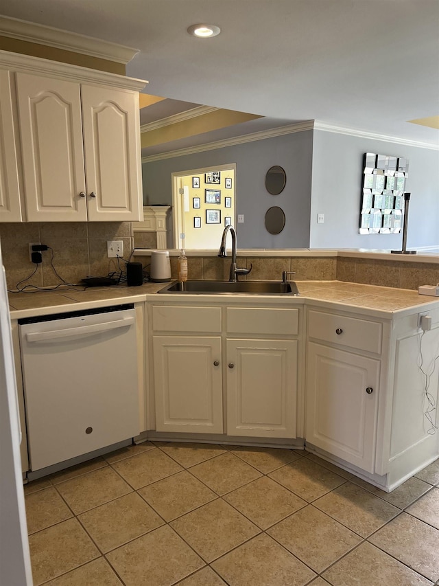 11 Willow Cv, Cabot, AR 72023 - kitchen with white dishwasher, crown molding, a sink, a peninsula, and white cabinets