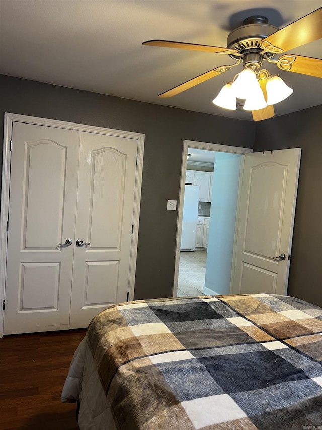 11 Willow Cv, Cabot, AR 72023 - bedroom with freestanding refrigerator, a closet, wood finished floors, and ceiling fan