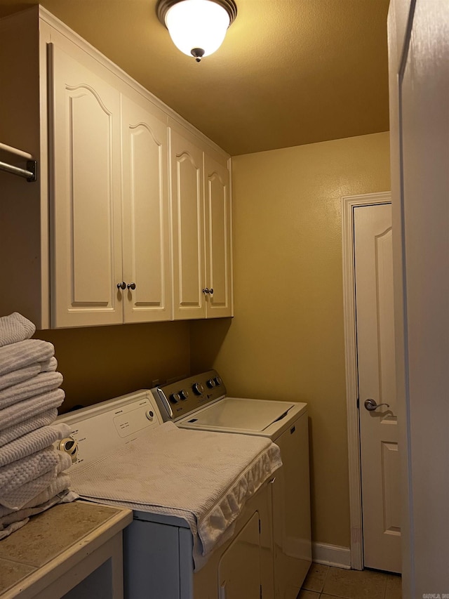 11 Willow Cv, Cabot, AR 72023 - washroom with washer and clothes dryer, cabinet space, and light tile patterned floors