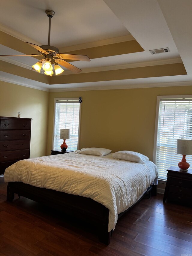 11 Willow Cv, Cabot, AR 72023 - bedroom with a tray ceiling, ornamental molding, dark wood-style floors, and ceiling fan