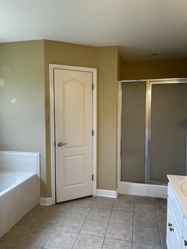 11 Willow Cv, Cabot, AR 72023 - full bath featuring a stall shower, vanity, a garden tub, and tile patterned floors