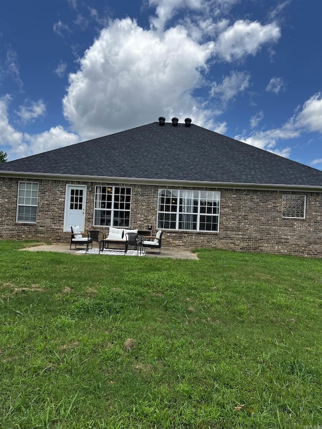 11 Willow Cv, Cabot, AR 72023 - back of house featuring brick siding, a shingled roof, and a patio area