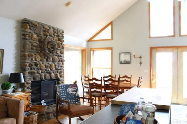 24 Roberts Rd, Edgemont, AR 72044 - living room featuring high vaulted ceiling, plenty of natural light, and a stone fireplace