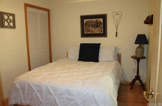 24 Roberts Rd, Edgemont, AR 72044 - bedroom featuring a closet and wood finished floors