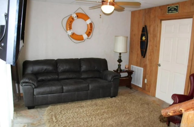 24 Roberts Rd, Edgemont, AR 72044 - living area with a ceiling fan, carpet floors, and wooden walls