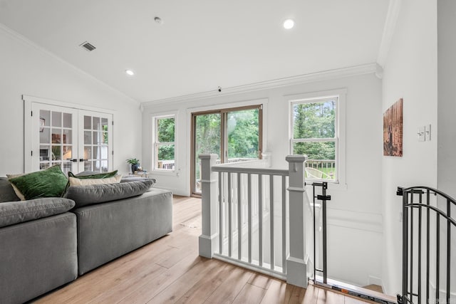 14320 Bradley Rd, Maumelle, AR 72113 - living room featuring ornamental molding, vaulted ceiling, french doors, light wood-style flooring, and recessed lighting