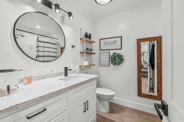 14320 Bradley Rd, Maumelle, AR 72113 - full bath featuring vanity, toilet, wood finished floors, ornamental molding, and baseboards