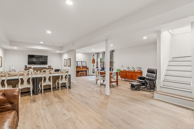 14320 Bradley Rd, Maumelle, AR 72113 - living room featuring light wood-type flooring, recessed lighting, and stairway