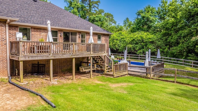 14320 Bradley Rd, Maumelle, AR 72113 - rear view of house with brick siding, a deck, a shingled roof, and stairway