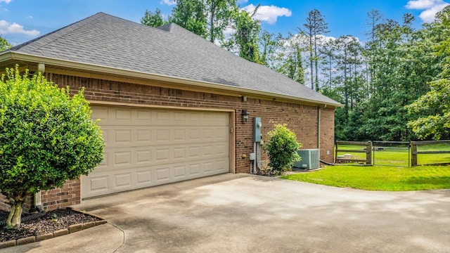 14320 Bradley Rd, Maumelle, AR 72113 - view of side of property with brick siding, roof with shingles, and driveway