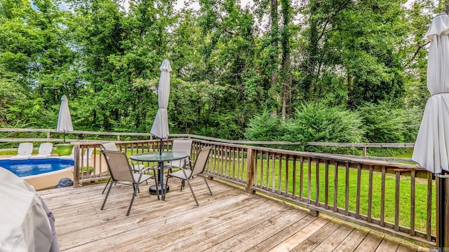 14320 Bradley Rd, Maumelle, AR 72113 - deck featuring outdoor dining area and view of wooded area