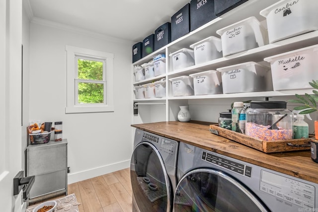 14320 Bradley Rd, Maumelle, AR 72113 - laundry room featuring ornamental molding, washer and dryer, baseboards, and light wood-type flooring