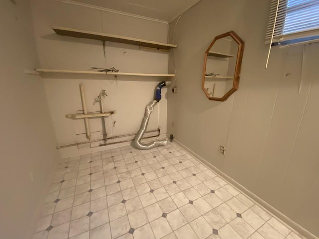 laundry room featuring ornamental molding