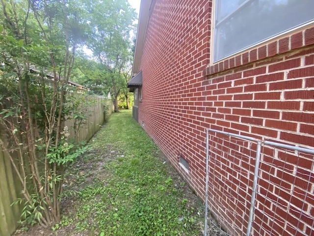 view of home's exterior featuring brick siding