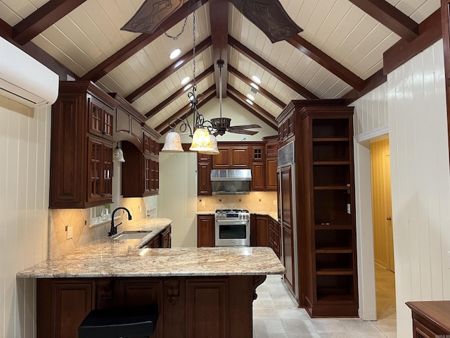 816 W 36th Ave, Pine Bluff, AR 71603 - kitchen featuring premium appliances, a sink, under cabinet range hood, a peninsula, and a wall mounted AC