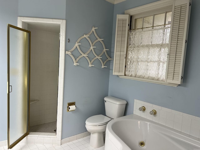 816 W 36th Ave, Pine Bluff, AR 71603 - bathroom featuring toilet, a shower stall, a jetted tub, tile patterned flooring, and baseboards