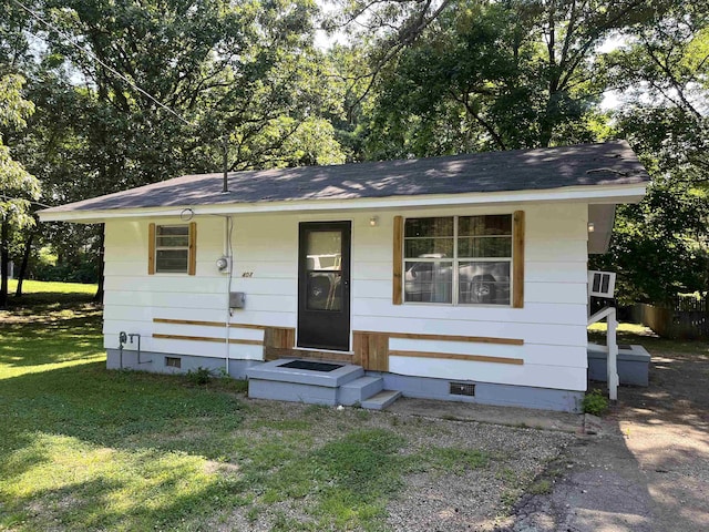 404 Rogers, Jonesboro, AR 72401 - view of front facade with crawl space, a front yard, and roof with shingles