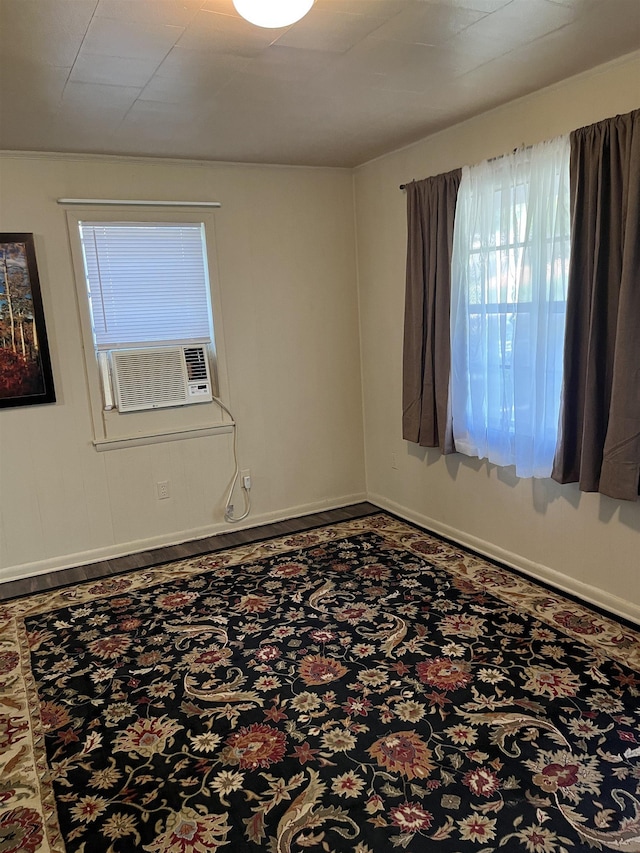 404 Rogers, Jonesboro, AR 72401 - unfurnished room with healthy amount of natural light, baseboards, and cooling unit