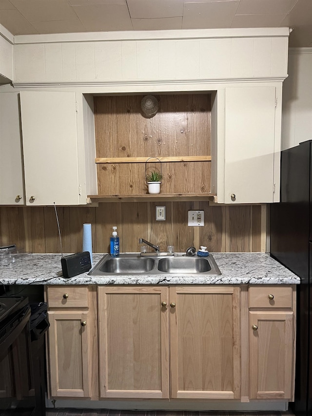 404 Rogers, Jonesboro, AR 72401 - kitchen with a sink, freestanding refrigerator, black range oven, open shelves, and light brown cabinetry