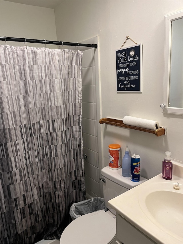 404 Rogers, Jonesboro, AR 72401 - full bathroom featuring toilet, curtained shower, and vanity
