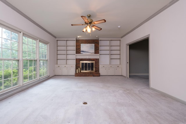 11 Bradbury Dr, Little Rock, AR 72212 - unfurnished living room with ornamental molding, built in shelves, baseboards, ceiling fan, and light carpet