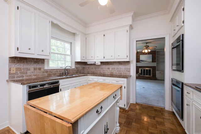 11 Bradbury Dr, Little Rock, AR 72212 - kitchen with a ceiling fan, wooden counters, a sink, oven, and ornamental molding