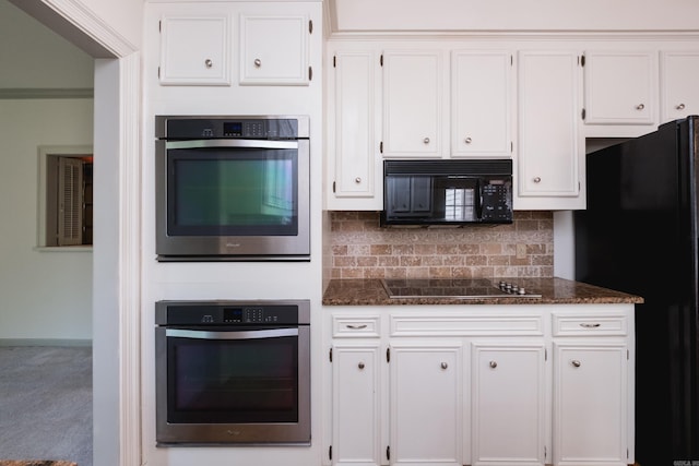 11 Bradbury Dr, Little Rock, AR 72212 - kitchen featuring black appliances, white cabinetry, decorative backsplash, and dark stone countertops