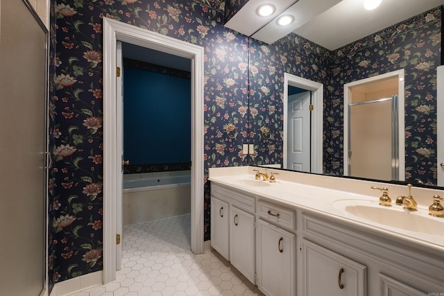 11 Bradbury Dr, Little Rock, AR 72212 - bathroom featuring double vanity, a garden tub, a shower stall, and tile patterned floors