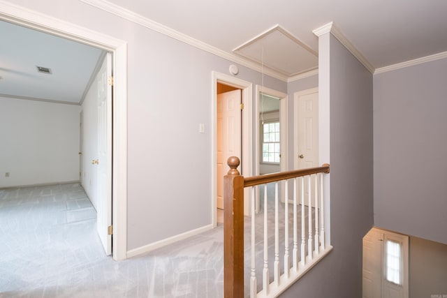 11 Bradbury Dr, Little Rock, AR 72212 - hall featuring attic access, crown molding, carpet, an upstairs landing, and baseboards