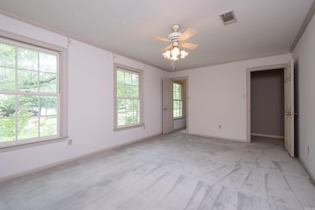 11 Bradbury Dr, Little Rock, AR 72212 - empty room featuring light carpet, baseboards, crown molding, and a ceiling fan