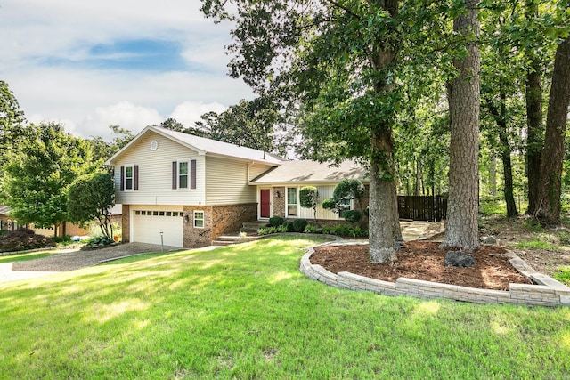 17 Point S Ct, Little Rock, AR 72211 - tri-level home with driveway, brick siding, a garage, and a front lawn
