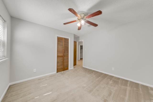 17 Point S Ct, Little Rock, AR 72211 - unfurnished bedroom with a closet, baseboards, carpet flooring, a textured ceiling, and ceiling fan