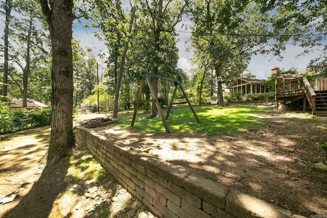 17 Point S Ct, Little Rock, AR 72211 - view of property's community featuring a playground, a wooden deck, stairway, and a lawn