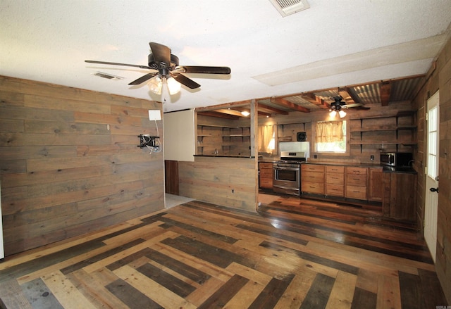 803 Reeder Rd, Leola, AR 72084 - kitchen with appliances with stainless steel finishes, wood walls, ceiling fan, open shelves, and dark countertops