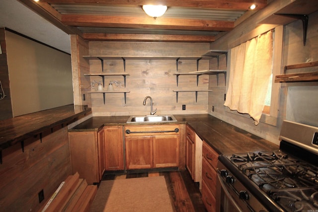 803 Reeder Rd, Leola, AR 72084 - kitchen featuring open shelves, gas stove, a sink, brown cabinetry, and dark countertops