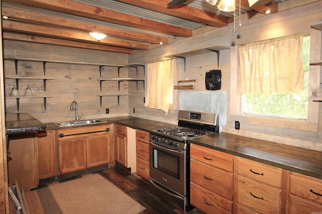 803 Reeder Rd, Leola, AR 72084 - kitchen with stainless steel gas range, a sink, dark countertops, healthy amount of natural light, and beam ceiling