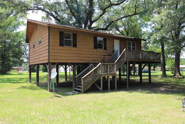 803 Reeder Rd, Leola, AR 72084 - beach home featuring stairs, a front lawn, and a deck