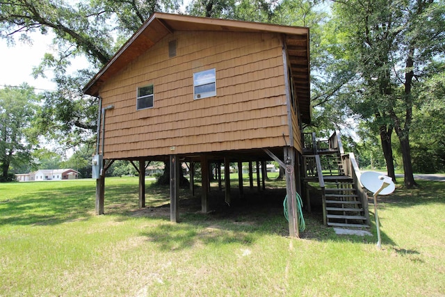 803 Reeder Rd, Leola, AR 72084 - view of property exterior featuring stairs, a yard, and a carport