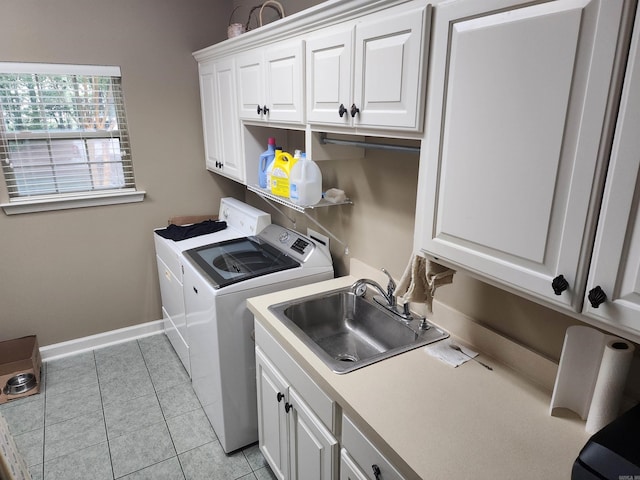 3165 Majestic Cir, Conway, AR 72034 - washroom featuring separate washer and dryer, cabinet space, and light tile patterned floors
