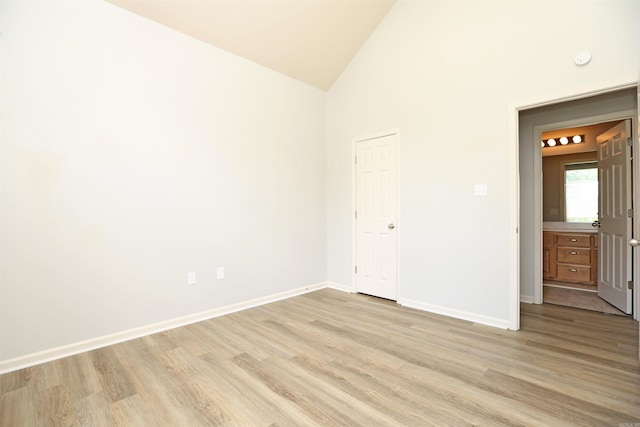 1118 Heights Rd, Benton, AR 72019 - unfurnished bedroom with light wood-style floors, baseboards, and high vaulted ceiling