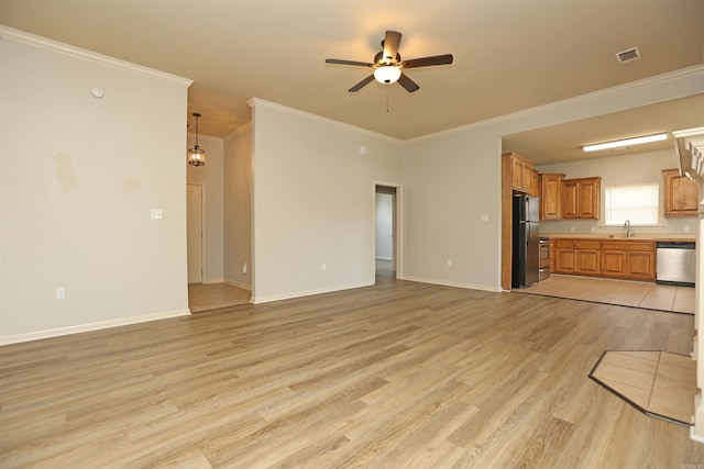 1118 Heights Rd, Benton, AR 72019 - unfurnished living room with a sink, a ceiling fan, light wood-type flooring, crown molding, and baseboards