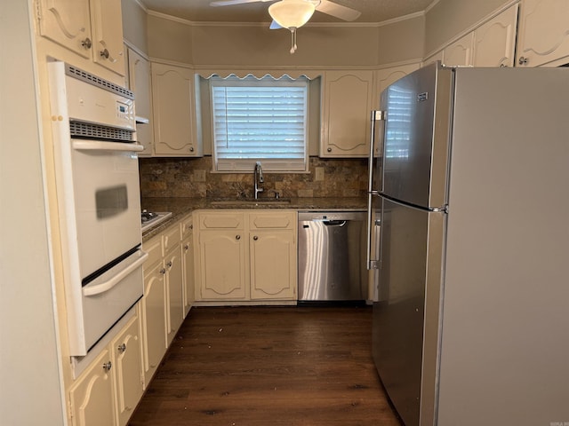 913 Schriner Ct, North Little Rock, AR 72116 - kitchen with stainless steel appliances, a warming drawer, dark wood-style flooring, ornamental molding, and white cabinets