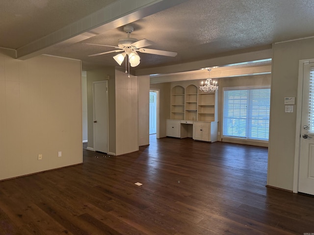 913 Schriner Ct, North Little Rock, AR 72116 - unfurnished living room with dark wood-type flooring, a chandelier, a textured ceiling, ceiling fan, and built in features
