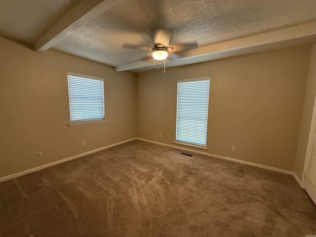 913 Schriner Ct, North Little Rock, AR 72116 - spare room featuring a ceiling fan, a textured ceiling, carpet floors, and beam ceiling