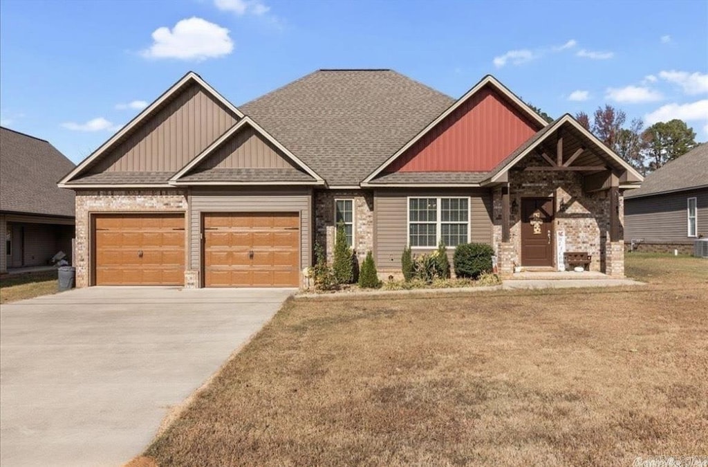 1210 Skyline Dr, Sheridan, AR 72150 - craftsman-style house with an attached garage, concrete driveway, board and batten siding, a shingled roof, and a front yard