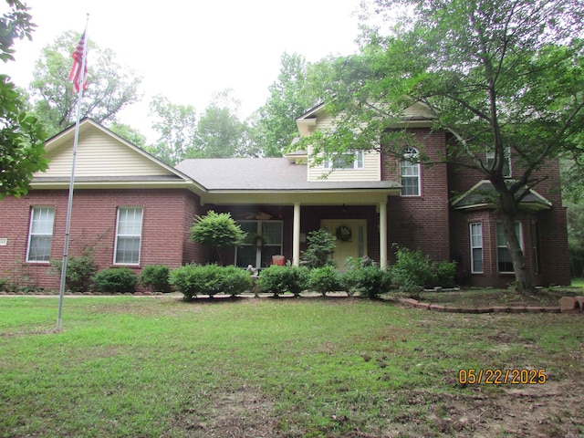 145 Eagles Nest Cv, Austin, AR 72007 - traditional home with a front yard and brick siding